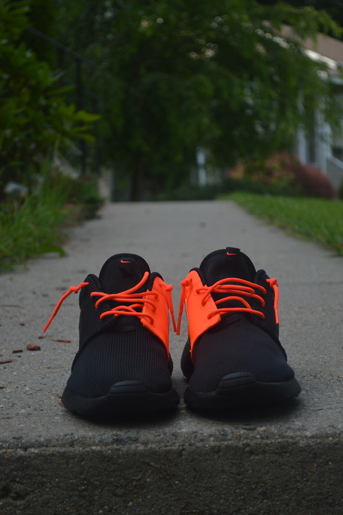black and orange gym shoes