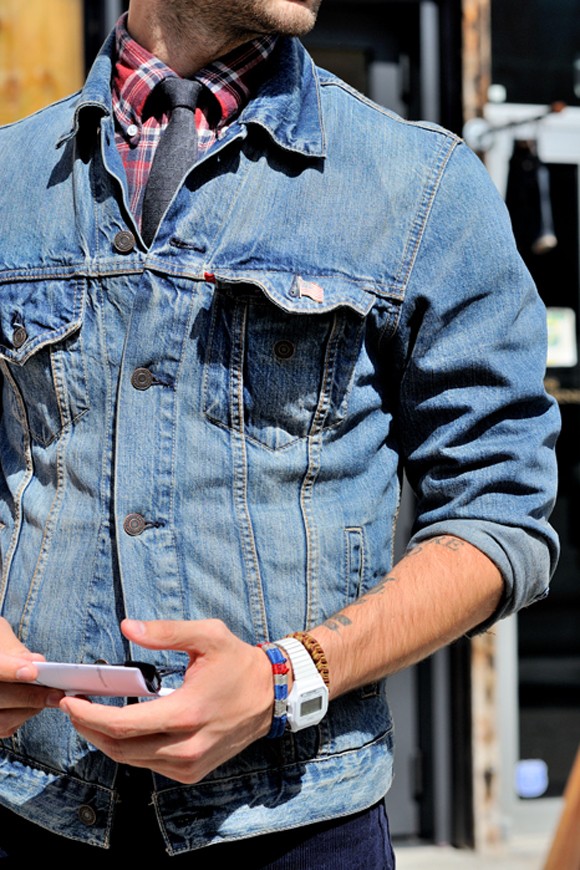Denim jacket, rolled up sleeves, white square watch, plaid red shirt and tie tartan