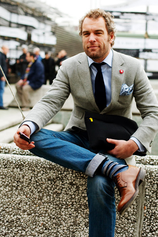 legs-crossed-relaxing-dotted-pocket-square-tie-tophat-funky-socks-brown-leather-dress-shoes-dexter-morgan
