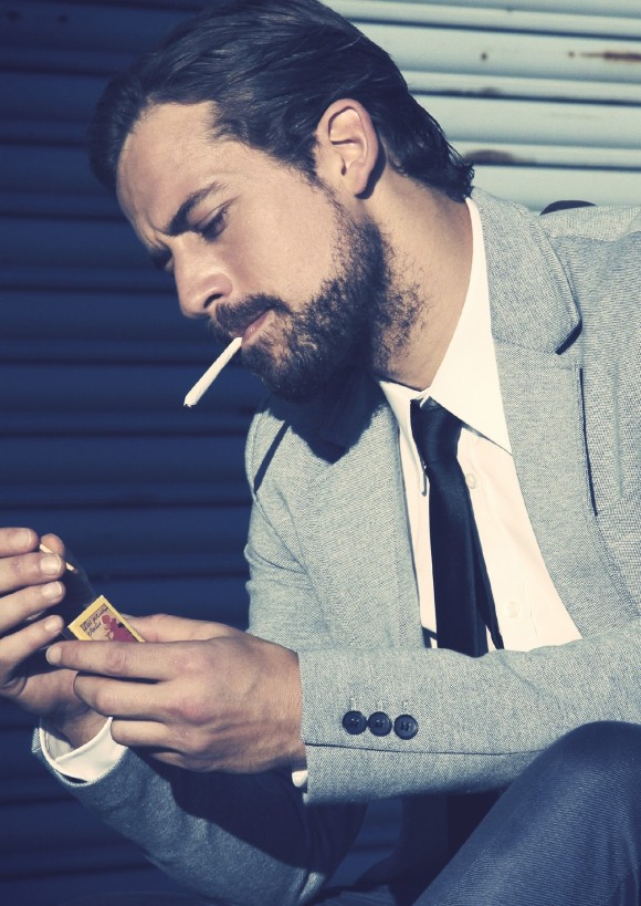 Lighting one up, slick hair and scruff - menswear style joint weed swag