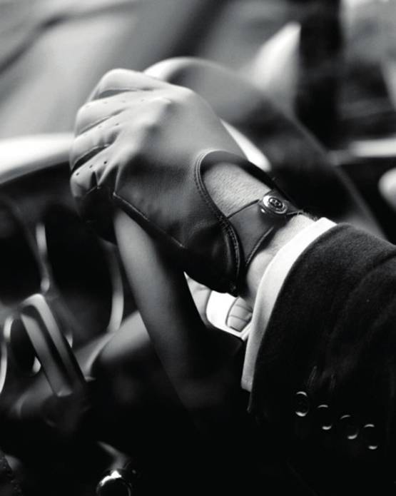 perforated-leather-driving-gloves-and-buttons-on-steering-wheel