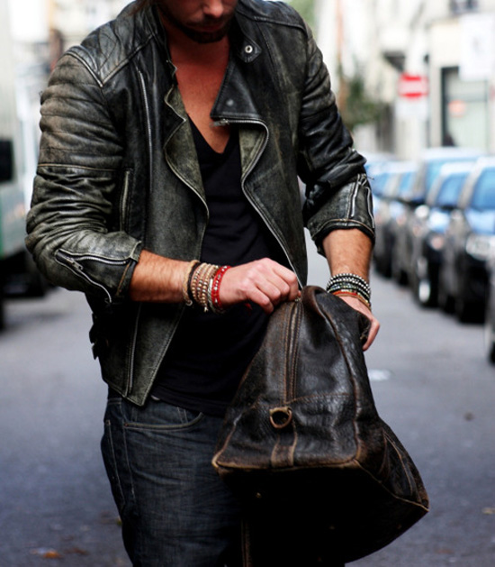 Leathers and Bracelets; biker jacket black deep v neck, dark blue jeans
