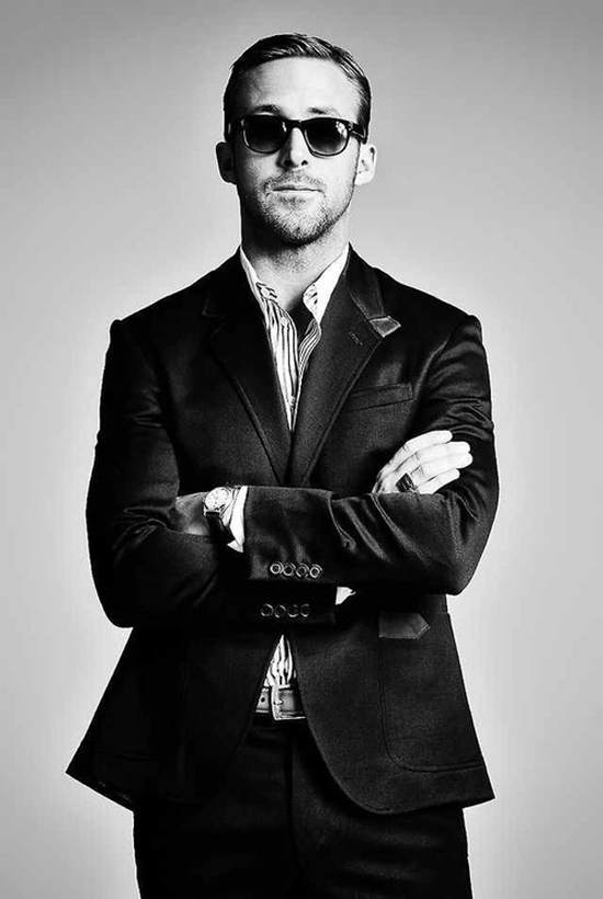 Ryan Gosling arms crossed in suit black & white